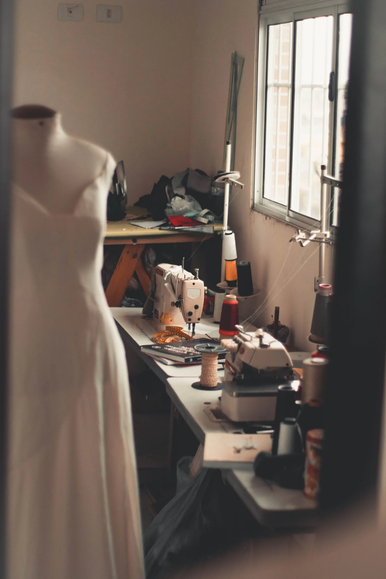 The atelier with a dress form by the window
