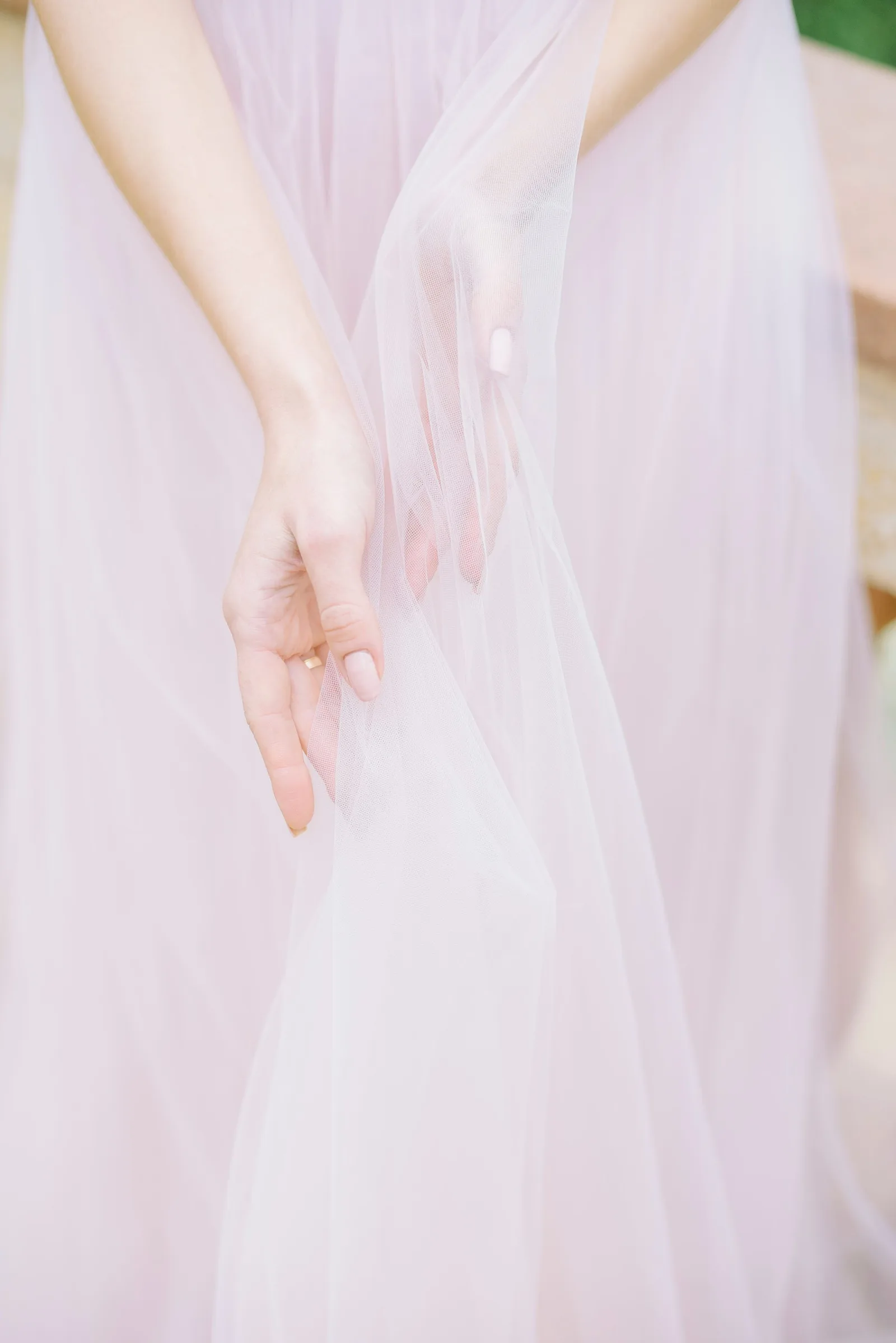 A hand resting on silk