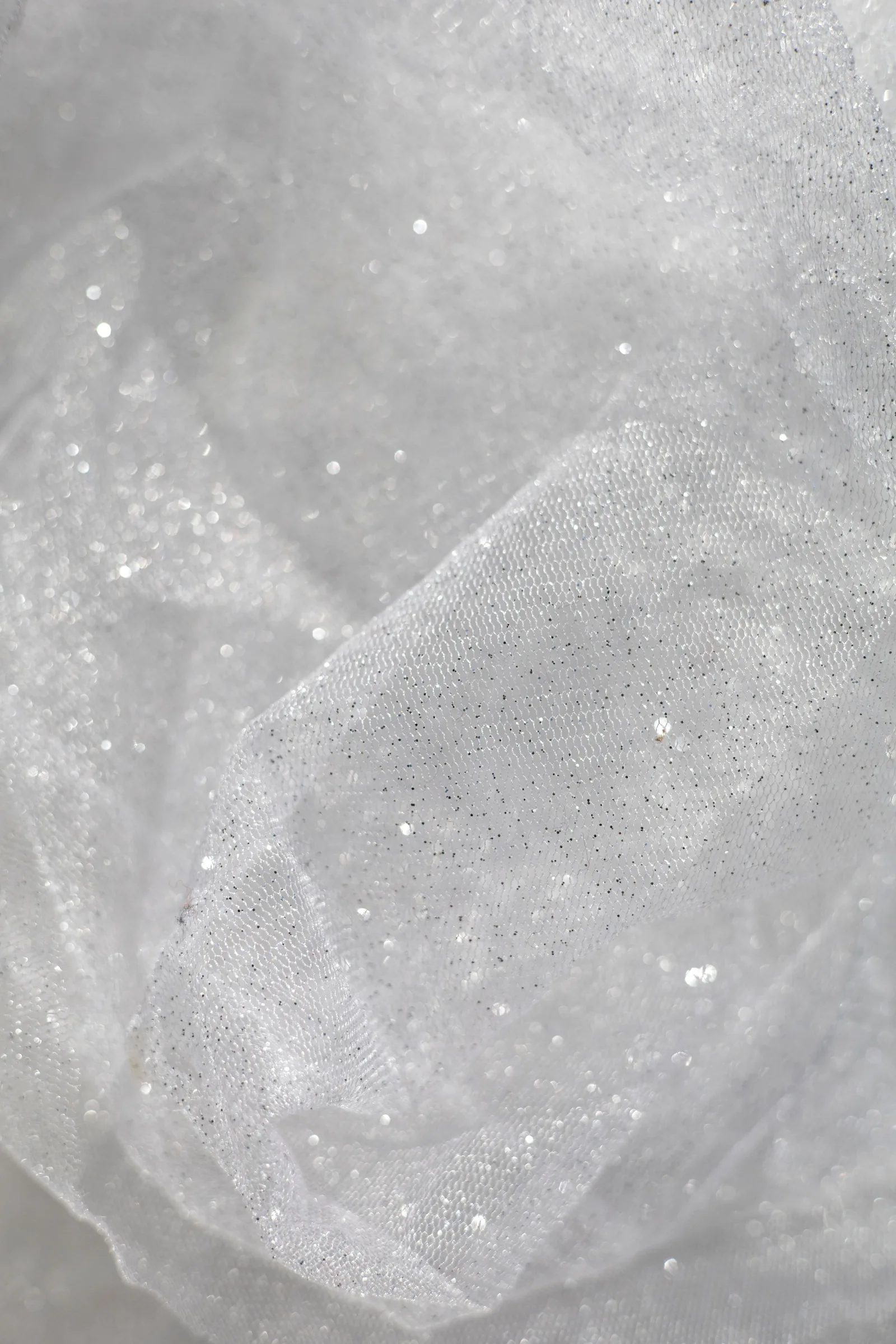 Shimmering white fabric, close up